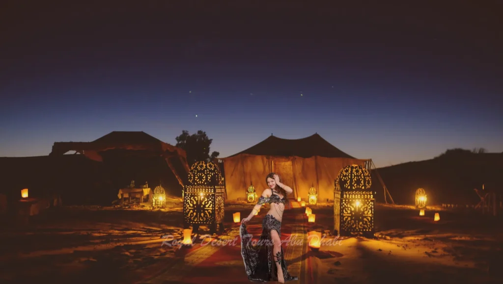 A skilled belly dancer captivates the audience with graceful movements during an evening desert safari in Abu Dhabi, adding cultural enchantment to a desert safari and BBQ dinner in Abu Dhabi under the stars.